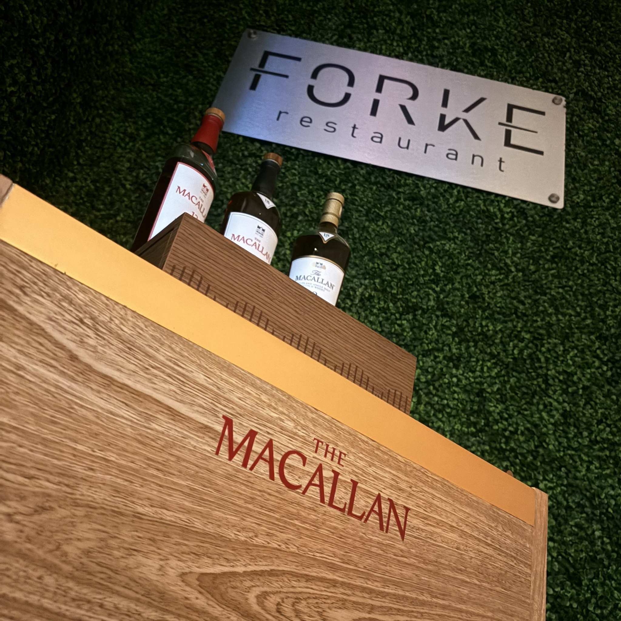 The Macallan whisky display beneath the Forke Restaurant sign in Las Vegas